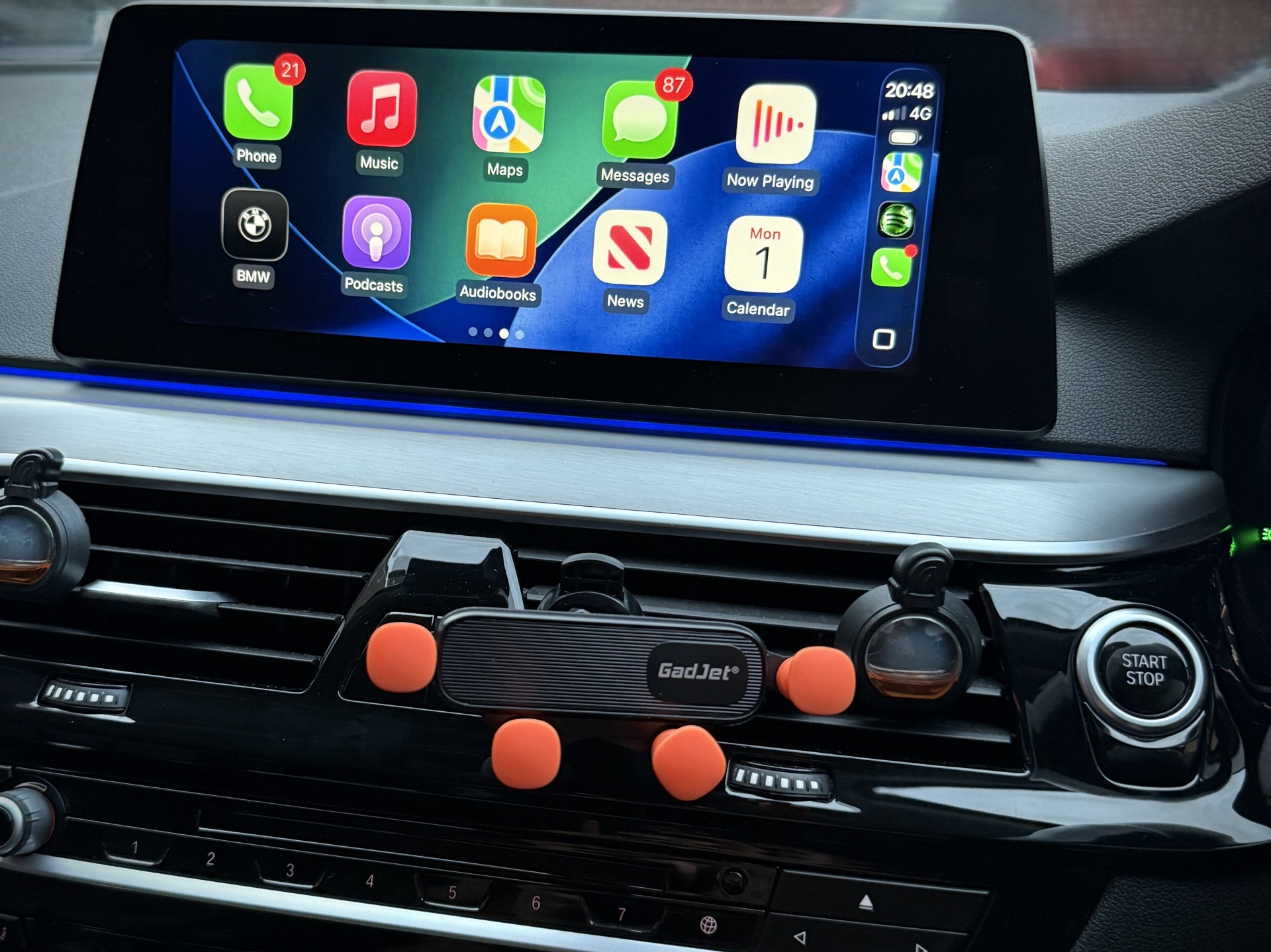 Laptop running BMW coding software with OBD cable